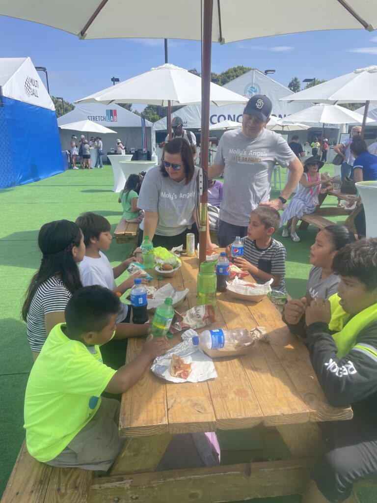 Tennis kids at a picnic table